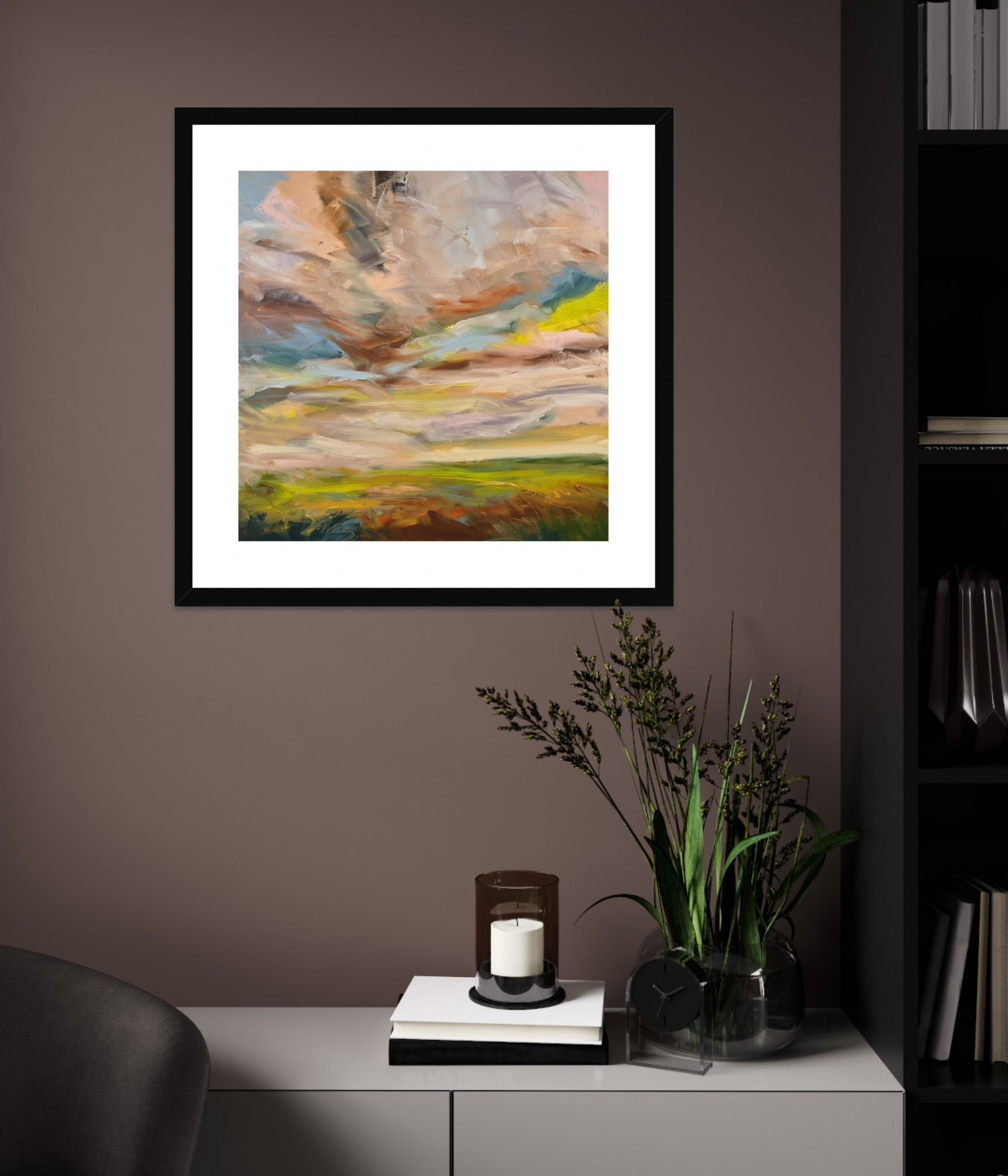 Framed abstract painting on a wall with a side table and decorative items below.