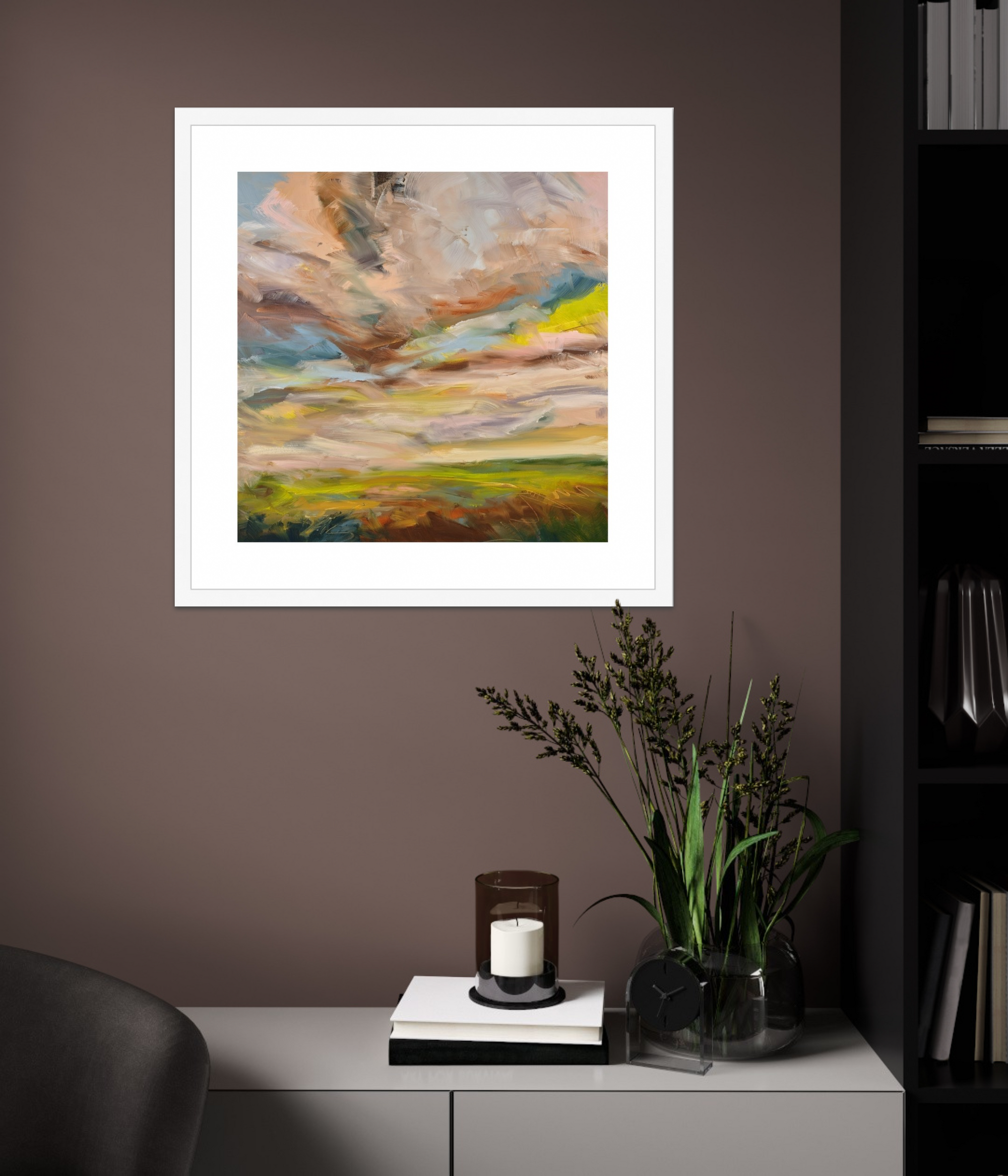 Framed abstract painting on a wall above a cabinet with decorative items.