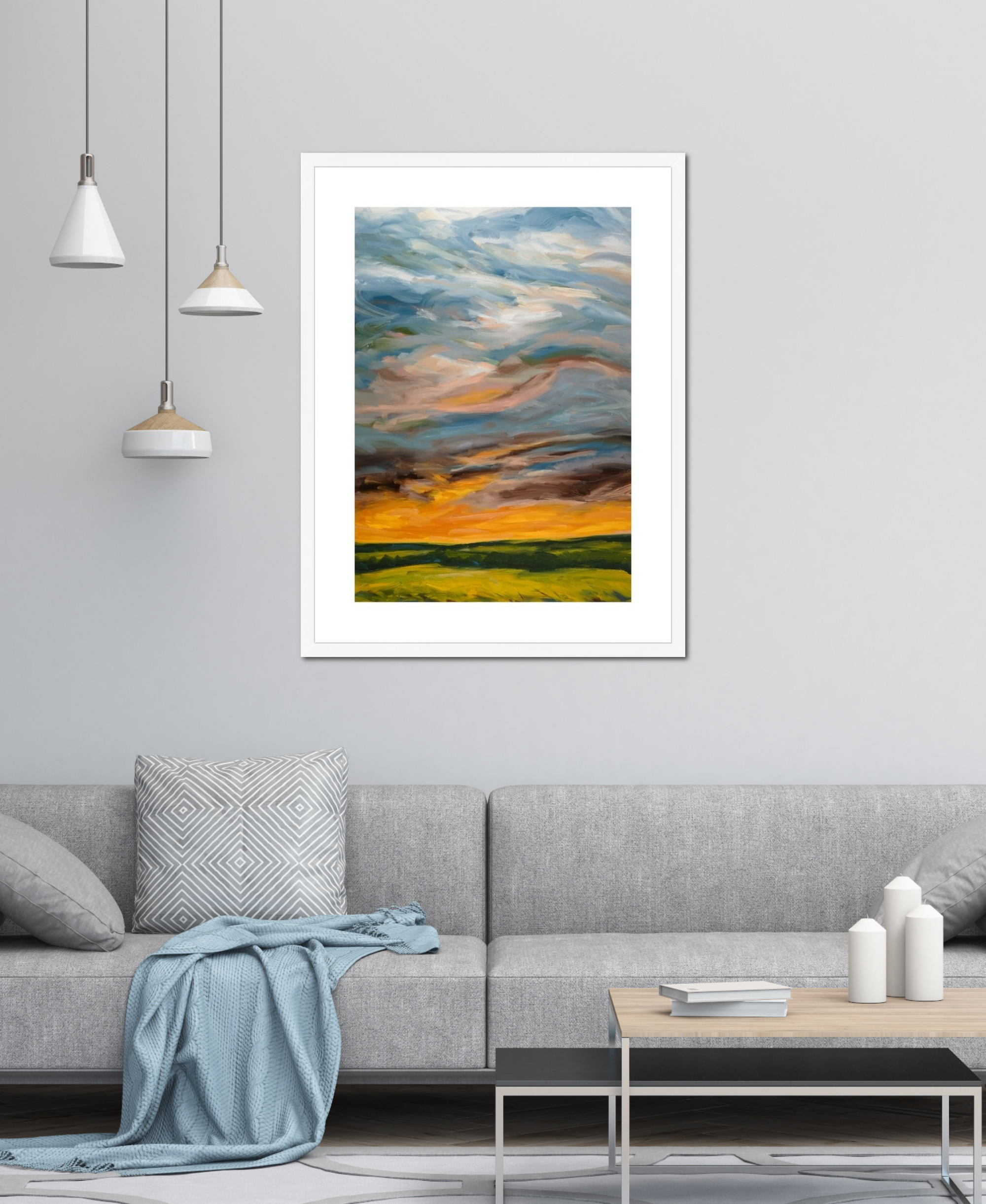 Framed abstract artwork on a wall above a sofa in a living room.