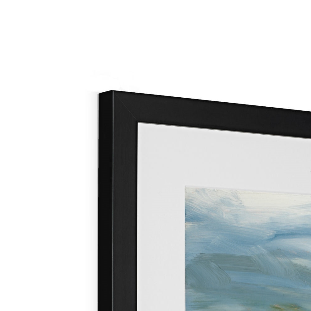 Close-up of a black framed abstract painting with a white background