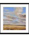 Framed painting of a landscape with clouds and fields.