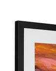 Framed abstract painting with a black frame on a white background