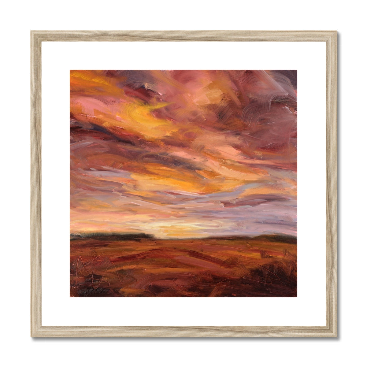 Framed abstract painting with warm colors on a white background
