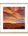 Framed abstract painting with warm colors on a white background
