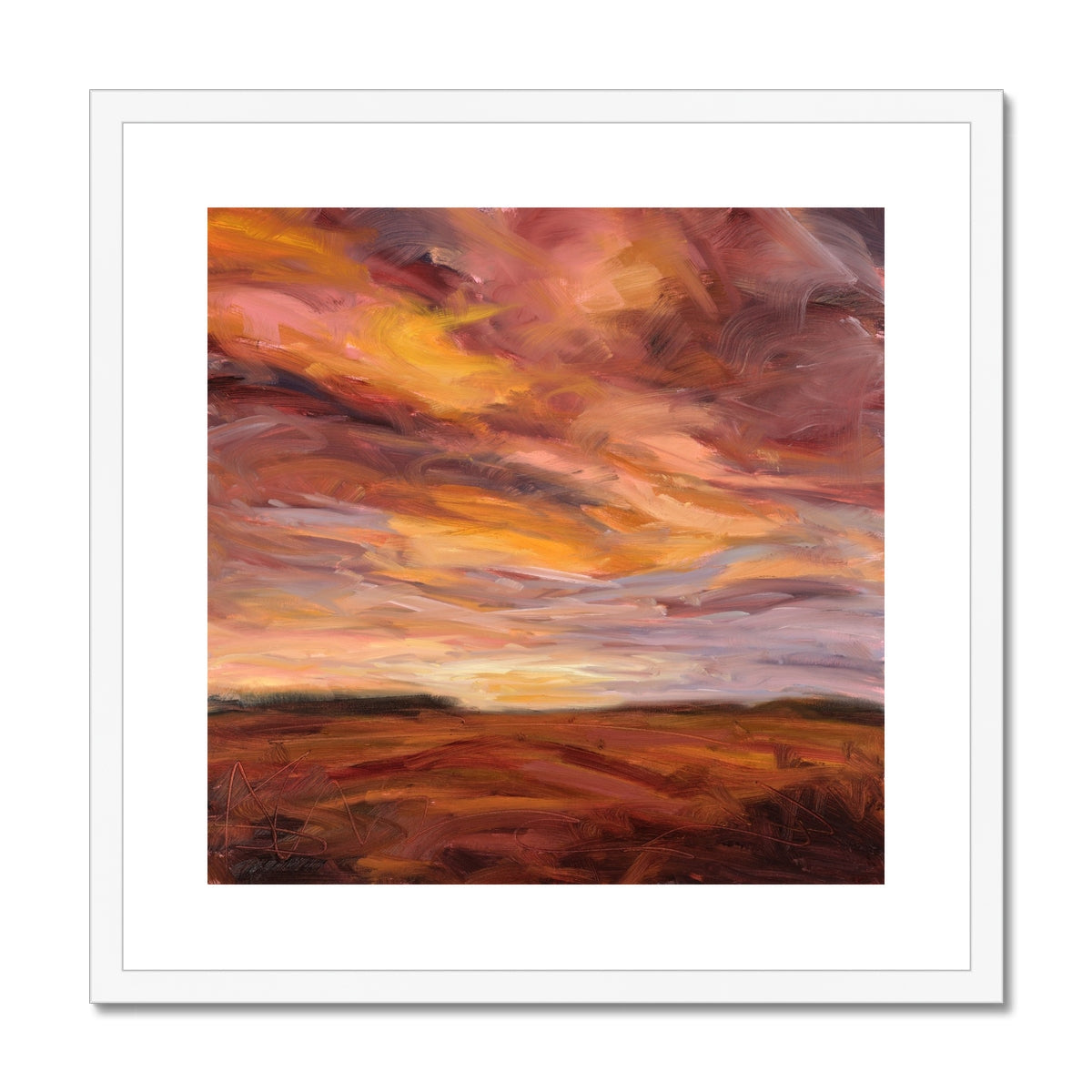 Framed abstract painting of a sunset sky with warm colors.