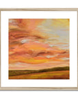 Framed abstract painting with warm colors on a white background