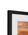 Framed abstract painting with a black frame on a white background