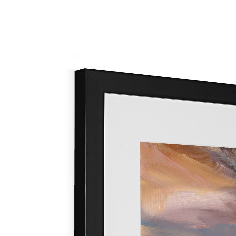Framed abstract painting with a black frame on a white wall