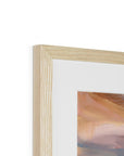 Close-up of a wooden picture frame with a painting inside on a white background