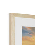 Close-up of a wooden picture frame with a blurred abstract painting inside on a white background