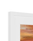 Close-up of a white frame with an abstract painting inside, showing a gradient of colors.