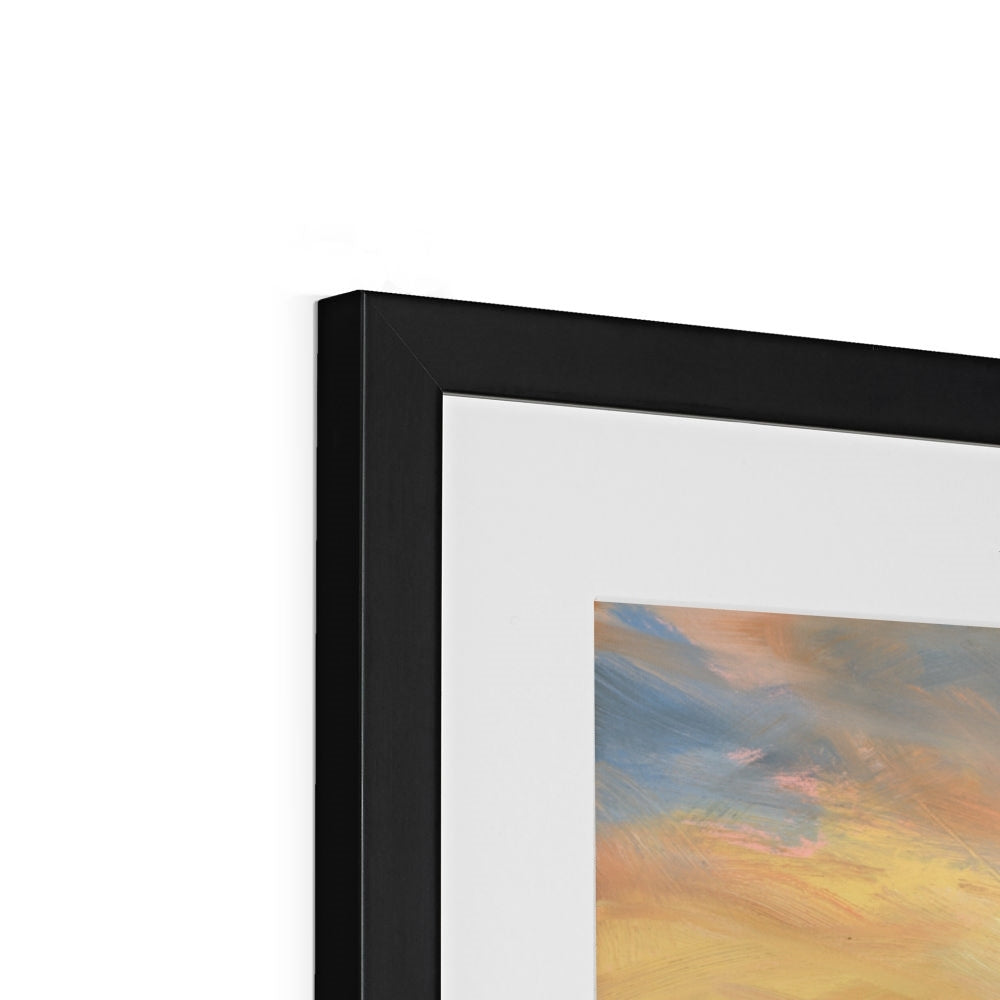 Close-up of a black framed artwork with abstract colors on a white background