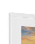 Close-up of a white frame with a colorful abstract painting inside.